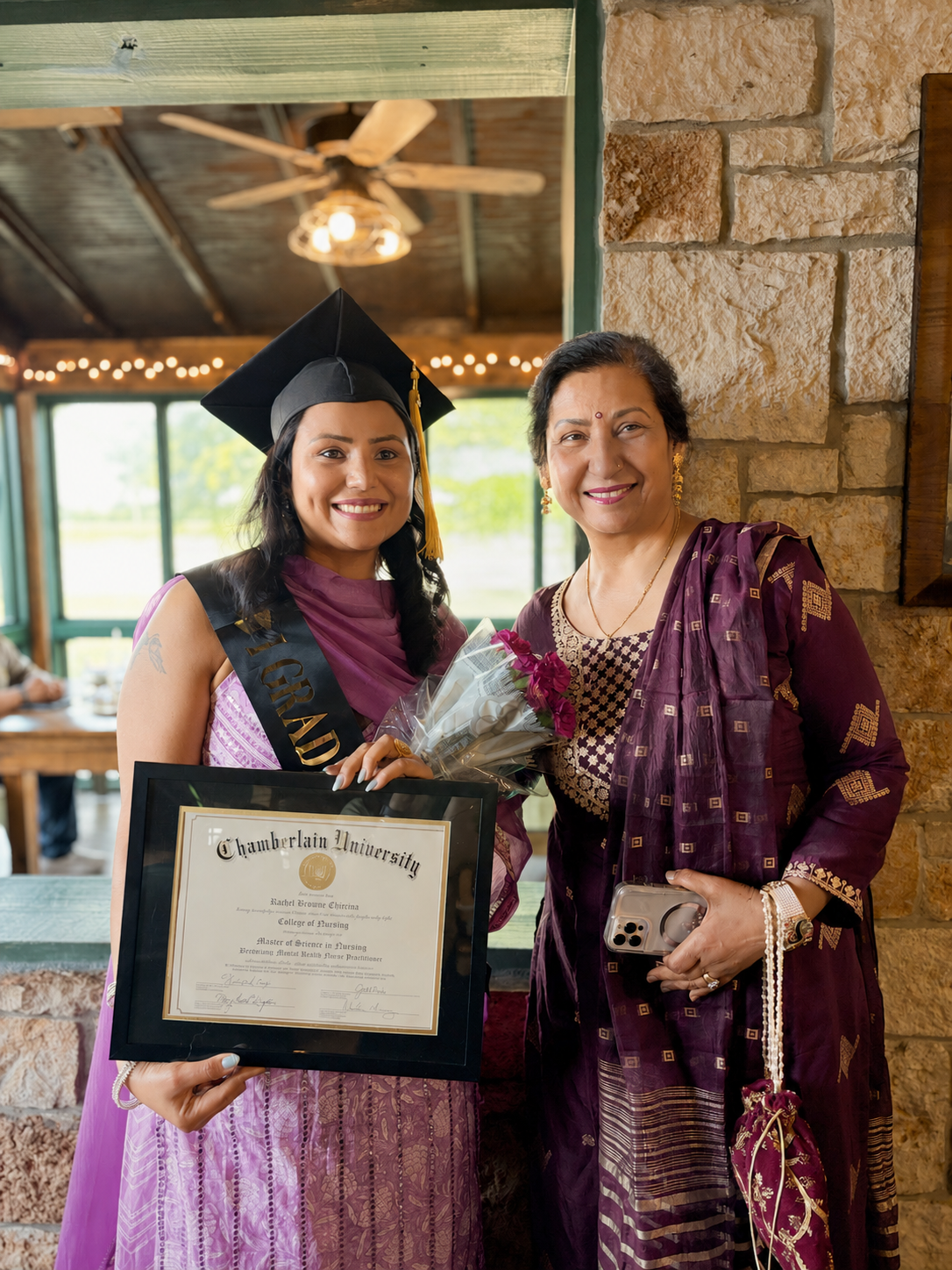 Rachel celebrating graduation with family